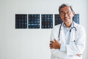 doctor smiling and explaining why acupuncture for brain injury is safe 