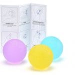 hand therapy balls with sheet of exercises behind it