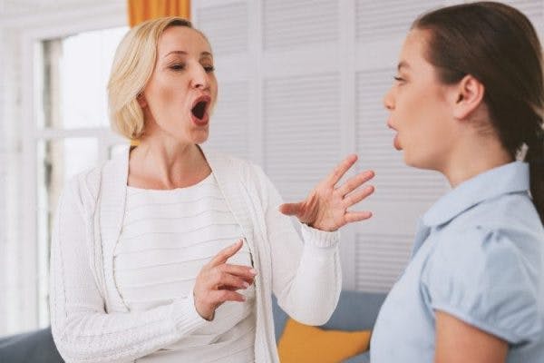 speech language pathologist guiding patient through exercises