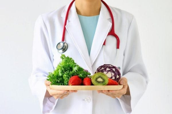 doctor with tray of healthy food to prevent a second stroke