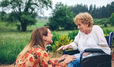 young woman talking to stroke survivor about how to manage ptsd