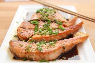 plate full of grilled salmon one of the best foods for brain injury recovery  