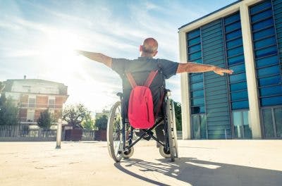 man in wheelchair looking at the sky wondering if tbi patients can fully recover