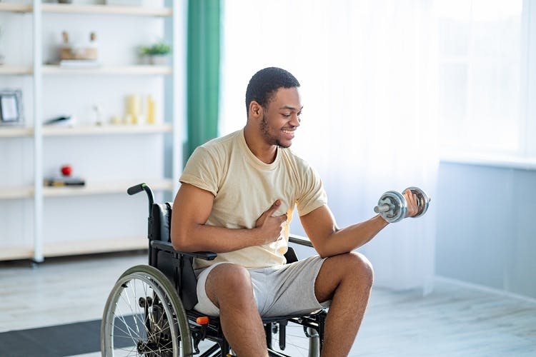 survivor happily engaging in a home exercise program for spinal cord injury