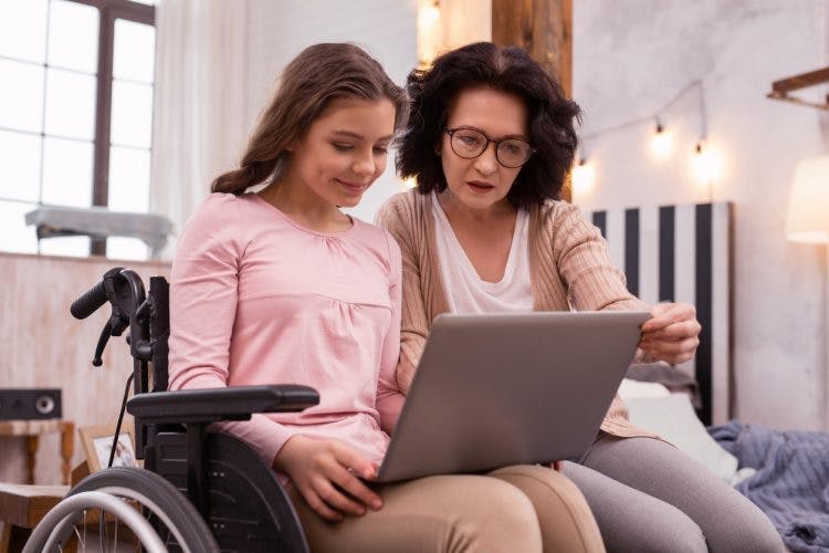 mother and daughter looking up spinal cord injury complications