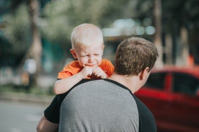 frustrated child with cerebral palsy throwing a temper tantrum