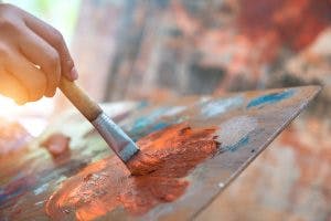 showing benefit of art therapy for brain injury patient with brush on palette