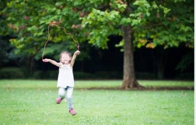 kid with cerebral palsy jumping rope to practice wrist movement