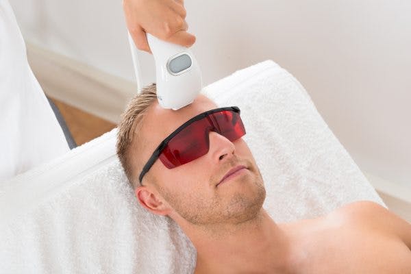 man trying cold laser therapy for brain injury