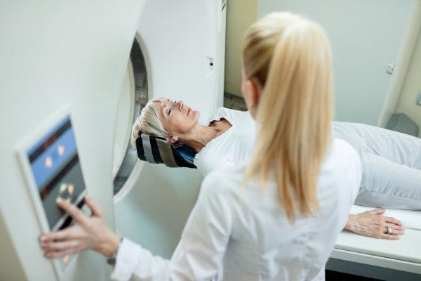 Woman being scanned for acquired brain injury