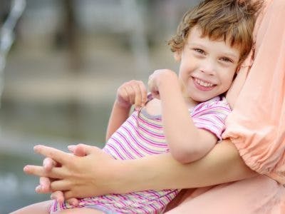 young girl with high muscle tone in the arms