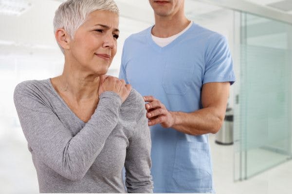 patient suffering with shoulder pain after stroke