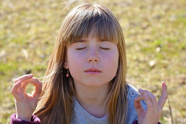 child using meditation for cerebral palsy psychological relief