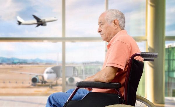 man waiting in airport terminal flying after stroke