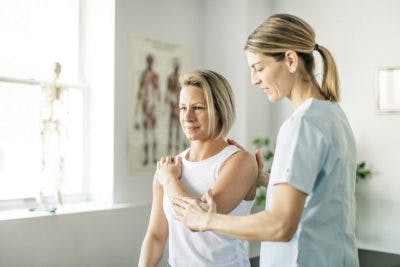 woman doing physical therapy for post-traumatic cervical dystonia