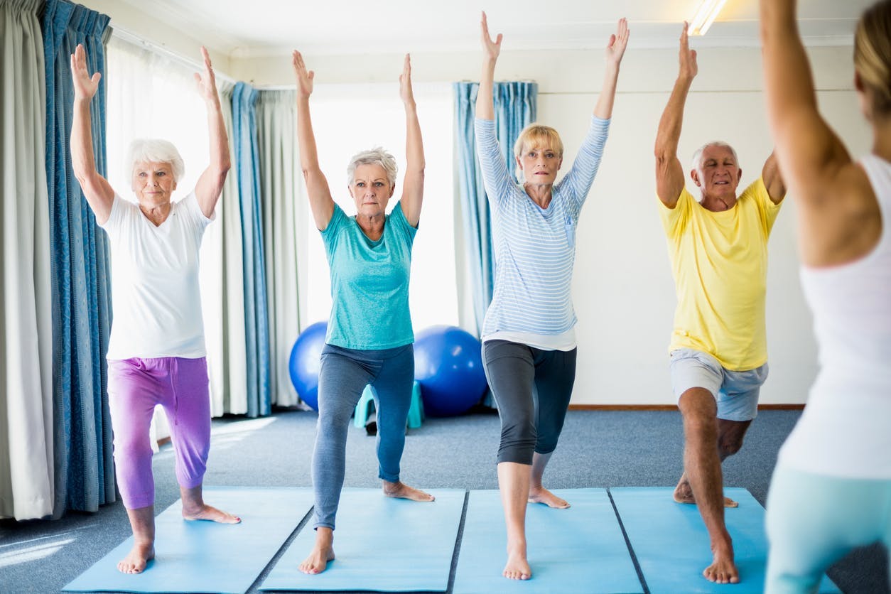 stroke patients doing gentle yoga poses at home