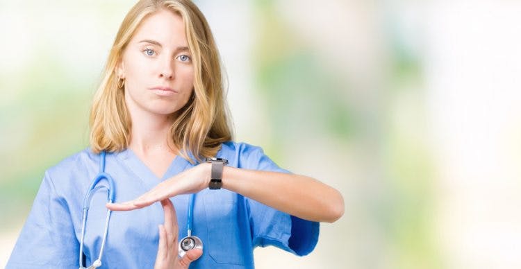 nurse signaling a time out break from aggressive behavior after stroke
