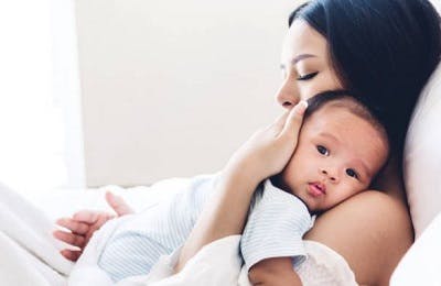 mother holding child with cerebral palsy