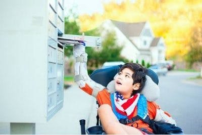 child with cerebral palsy practicing using a key