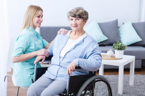 therapist working with stroke patient with right sided hemiplegia
