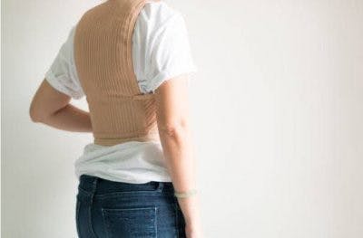 individual with spinal cord injury wearing spinal brace to manage scoliosis