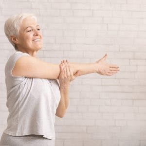 stroke patient works on arm exercises at home
