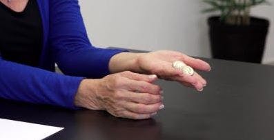 therapist holding quarters in her palm