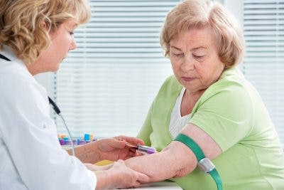 doctor drawing patient's blood to test for pituitary dysfunction after traumatic brain injury