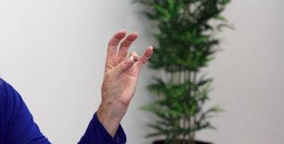 therapist touching thumb to ring finger for advanced hand exercises