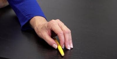 physical therapist showing hand exercise for stroke patients