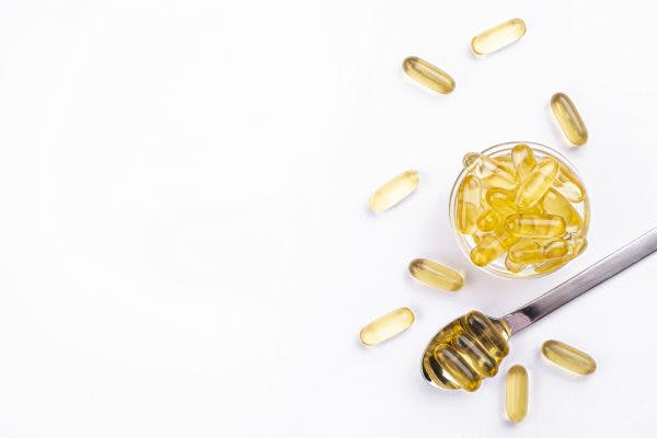 spoonful of fish oil pills with omega 3s