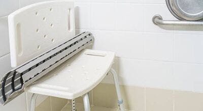 safety seat in the bathtub with non-slip mat sitting on top