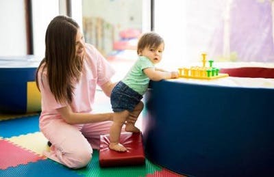 toddler with cerebral palsy getting physical therapy