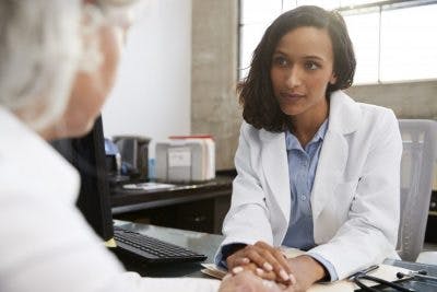 Doctor listening to stroke patient's concern