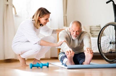 spinal cord injury patient stretching at physiotherapy