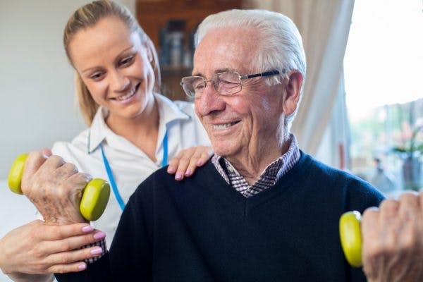 Therapist helping patient with stroke rehabilitation techniques
