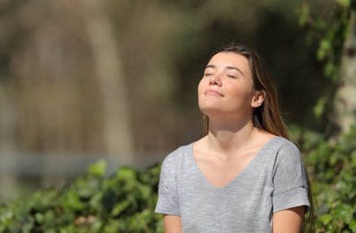 spinal cord injury patient outside practicing deep breathing exercises