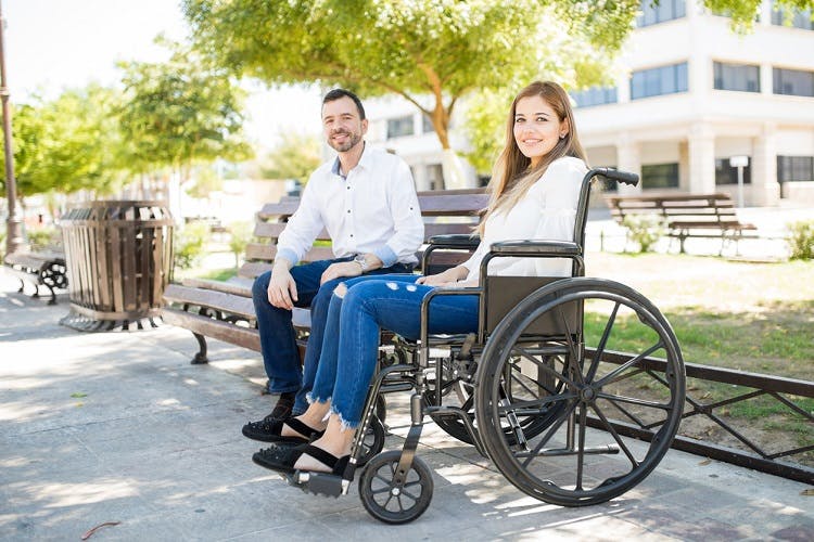 woman with incomplete quadriplegia in a wheelchair with significant other