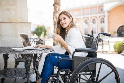 woman in wheelchair at cafe