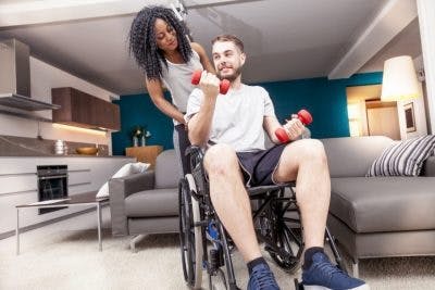 individual with incomplete quadriplegia participating in physical therapy to improve upper body functions