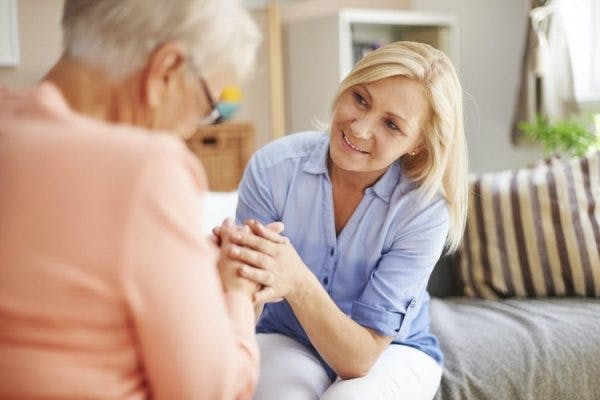 caregiver comforting patient with mood swings after stroke