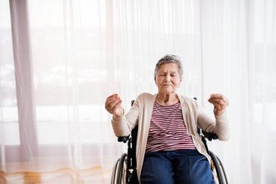 SCI patient praciting yoga to promote relaxation