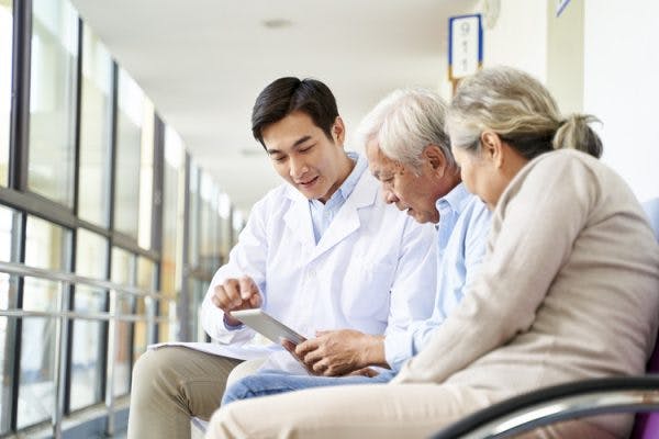 doctor explaining conduction aphasia to patient and his wife