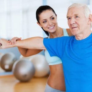 physical therapist helping stroke patient regain muscle function