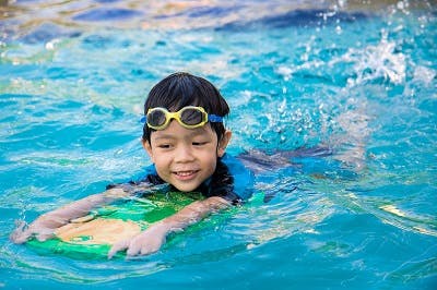 child with cerebral palsy practicing aquatic therapy exercises