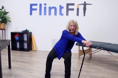therapist demonstrating stretches for stroke patients