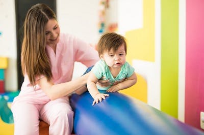 baby with cerebral palsy getting physical therapy for hypotonia