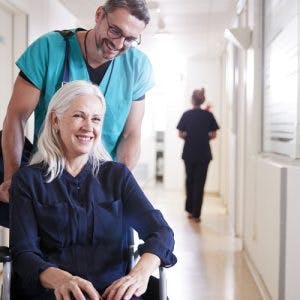 nurse explaining spinal cord injury recovery statistics to help patient understand that recovery is possible