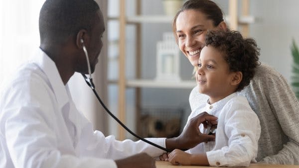 doctor using stethoscope on child with cerebral palsy and seizures