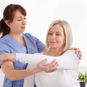 Doctor and patient in rehabilitation clinic after getting intrathecal baclofen pump to manage spasticity